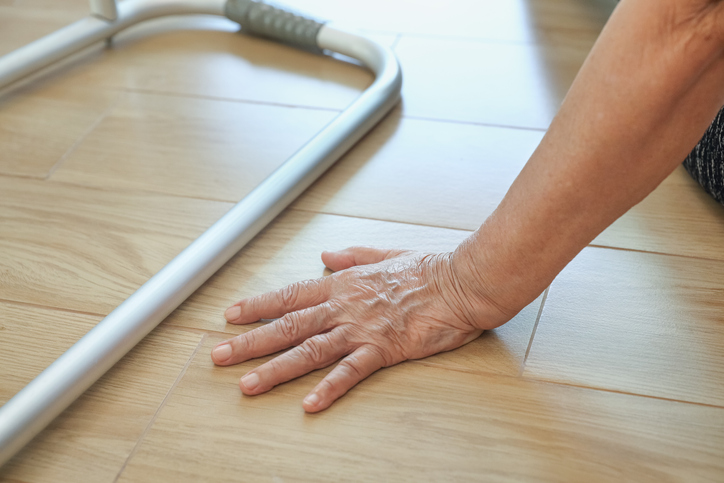 elderly person falls - elderly woman falling down with walker in her home