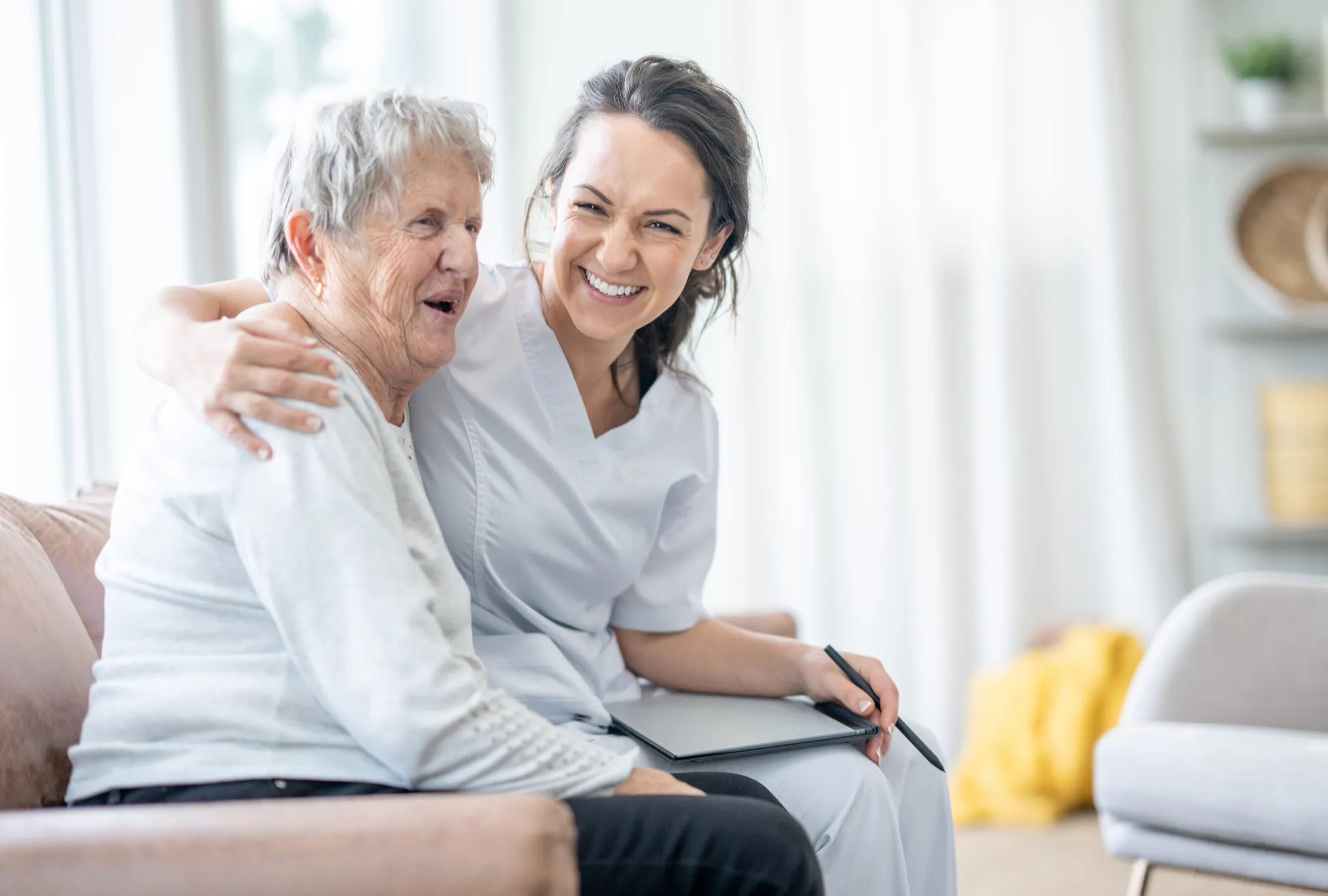 respite-care-services Respite care services in Michigan - caretaker and elderly woman smiling and hugging